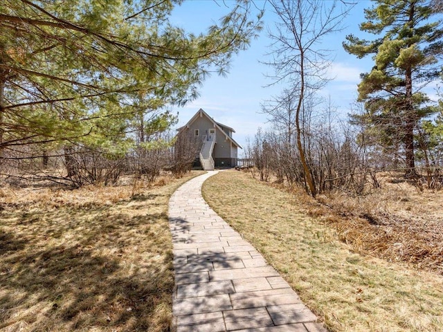 view of side of home with a barn