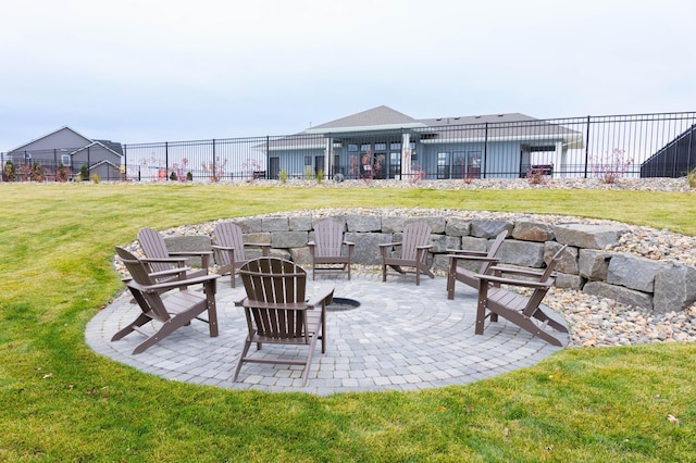 view of patio with fence and a fire pit