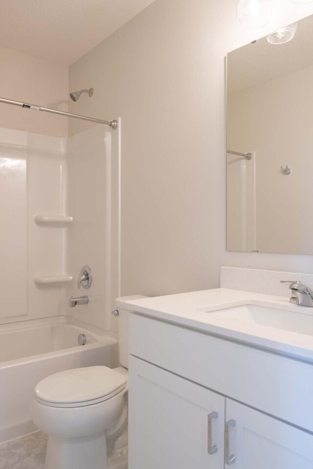 bathroom with toilet, bathing tub / shower combination, and vanity