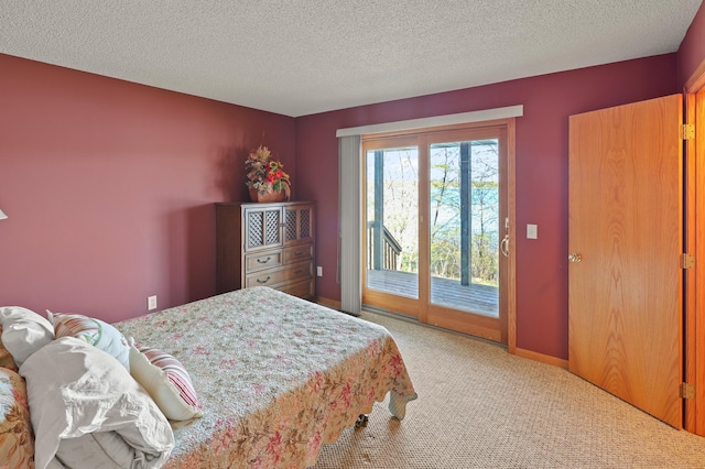 10209 Amery Ave NW, Silver Creek Twp, MN 55362 - bedroom featuring access to exterior, light colored carpet, and a textured ceiling