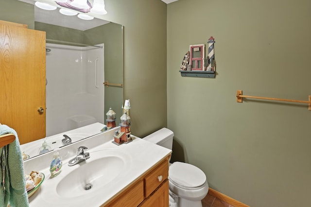 10209 Amery Ave NW, Silver Creek Twp, MN 55362 - bathroom with toilet, a shower, vanity, and baseboards