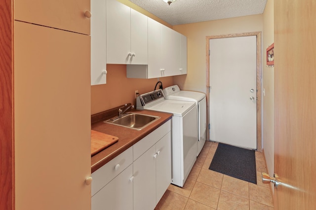 10209 Amery Ave NW, Silver Creek Twp, MN 55362 - clothes washing area with cabinet space, washer and dryer, a textured ceiling, and light tile patterned floors