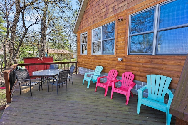 10209 Amery Ave NW, Silver Creek Twp, MN 55362 - wooden terrace with outdoor dining area