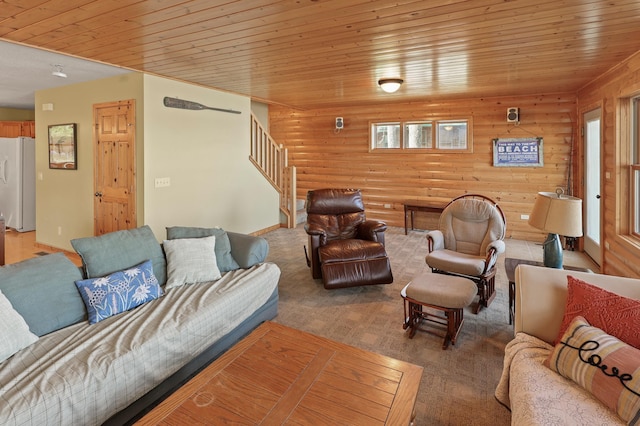 10209 Amery Ave NW, Silver Creek Twp, MN 55362 - living room featuring stairs, wood ceiling, and log walls