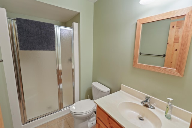 10209 Amery Ave NW, Silver Creek Twp, MN 55362 - full bathroom with a shower stall, vanity, toilet, and tile patterned floors