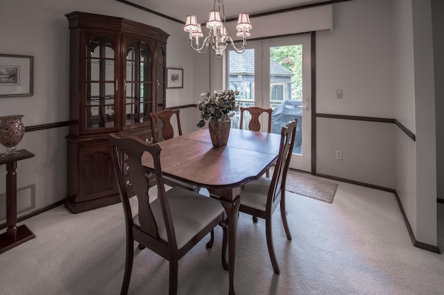 10929 108th Ave N, Maple Grove, MN 55369 - dining room with light colored carpet and a chandelier