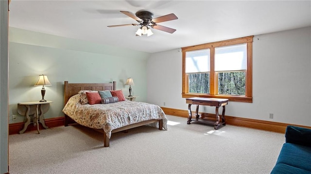 bedroom with carpet floors, a ceiling fan, and baseboards