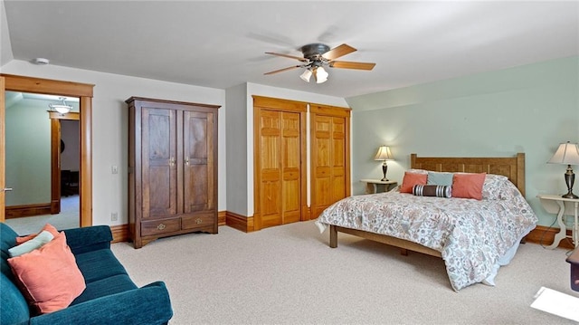 carpeted bedroom featuring a closet, baseboards, and ceiling fan