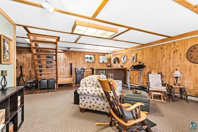 carpeted living area with wood walls