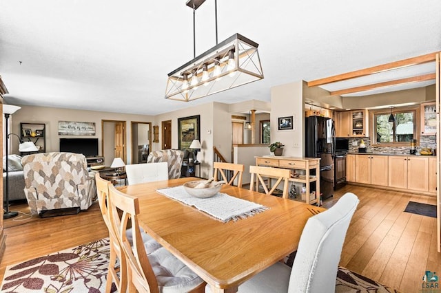 dining area with light wood finished floors