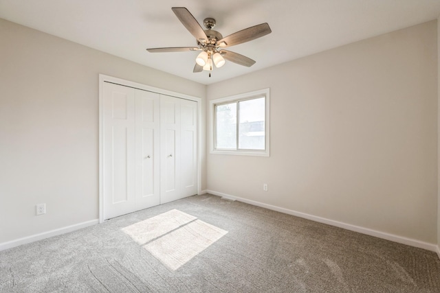 601 Harry Davis Ln, Minneapolis, MN 55411 - unfurnished bedroom with carpet, a closet, baseboards, and ceiling fan