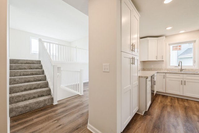 601 Harry Davis Ln, Minneapolis, MN 55411 - kitchen featuring a sink, dark wood finished floors, white cabinetry, light countertops, and recessed lighting