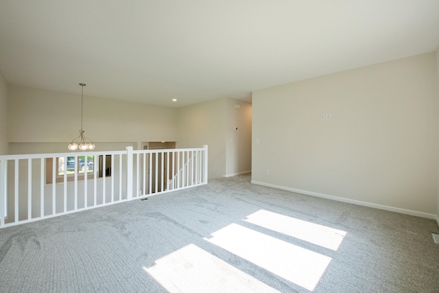 601 Harry Davis Ln, Minneapolis, MN 55411 - carpeted spare room featuring a chandelier and baseboards