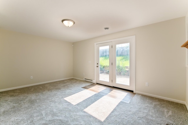 601 Harry Davis Ln, Minneapolis, MN 55411 - carpeted spare room featuring a baseboard radiator and baseboards