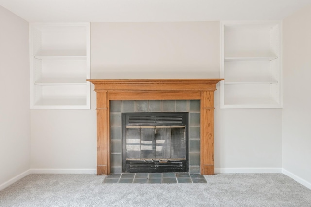 601 Harry Davis Ln, Minneapolis, MN 55411 - detailed view of carpet flooring, baseboards, and a tile fireplace