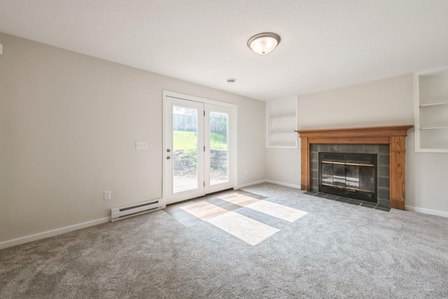 601 Harry Davis Ln, Minneapolis, MN 55411 - unfurnished living room featuring a baseboard heating unit, carpet floors, a fireplace, and baseboards