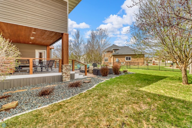 view of yard with fence and an outdoor living space