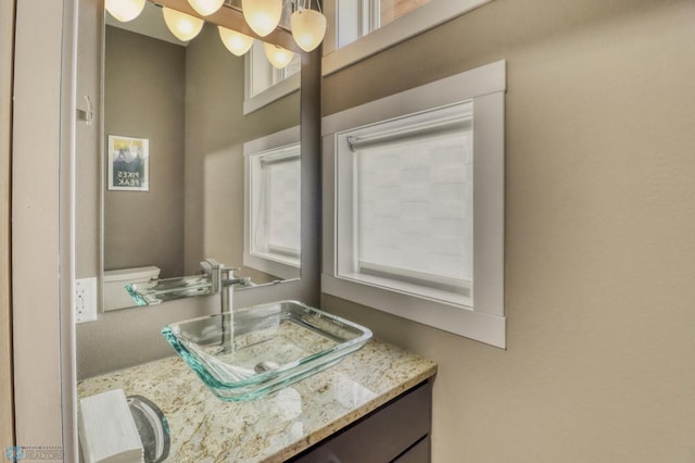 half bathroom with vanity