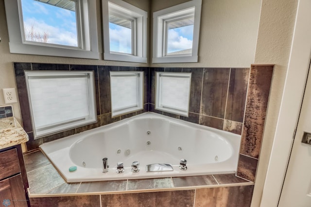 full bath with a whirlpool tub