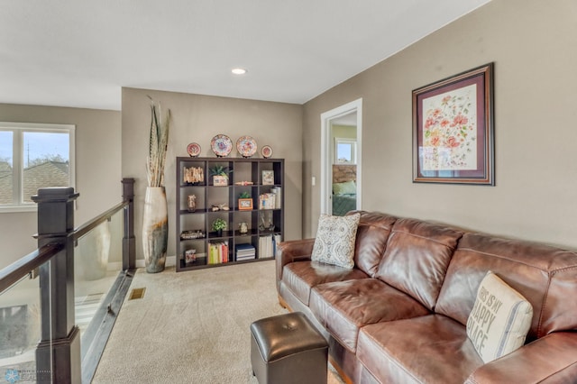 carpeted living room featuring recessed lighting
