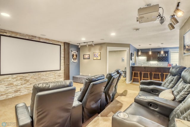 home theater with rail lighting, light carpet, and recessed lighting