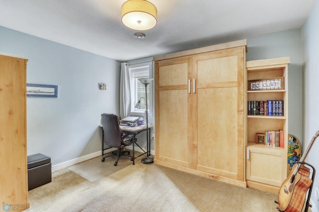 office space with baseboards and carpet floors