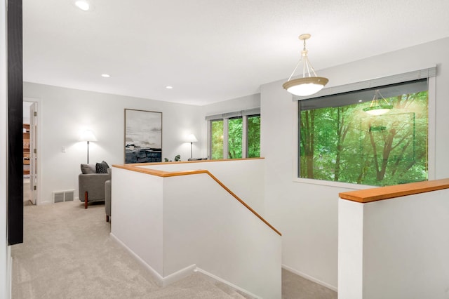 2117 Indian Rd W, Minnetonka, MN 55305 - hallway featuring an upstairs landing, light colored carpet, recessed lighting, and baseboards