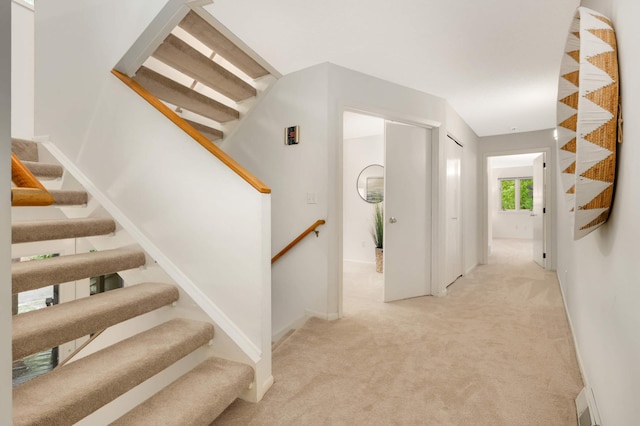 2117 Indian Rd W, Minnetonka, MN 55305 - hall featuring carpet floors, baseboards, and stairs