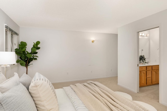 2117 Indian Rd W, Minnetonka, MN 55305 - bedroom with light colored carpet, connected bathroom, and baseboards