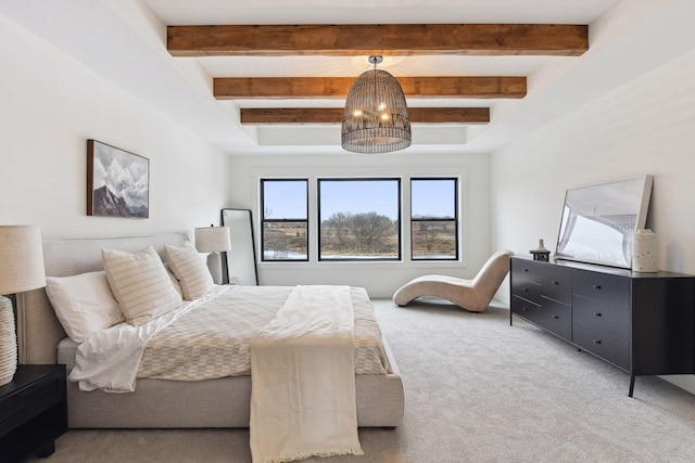 carpeted bedroom with beamed ceiling and a chandelier