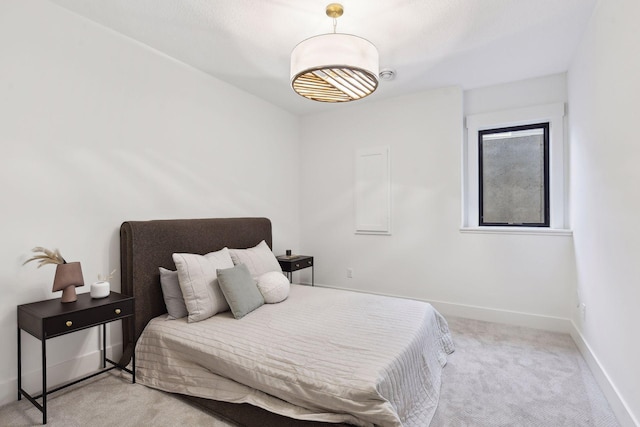 carpeted bedroom with baseboards
