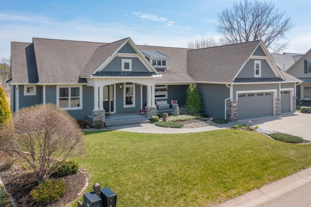 craftsman inspired home with a porch, driveway, a garage, a front lawn, and a shingled roof