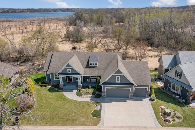 birds eye view of property featuring a water view