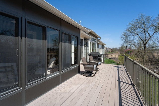 wooden deck featuring area for grilling