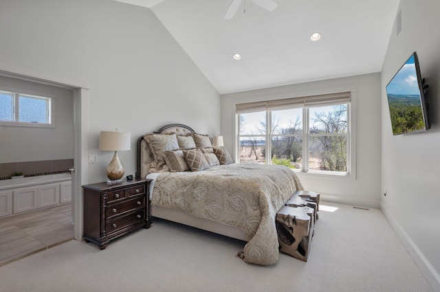 bedroom featuring light carpet, recessed lighting, a ceiling fan, ensuite bath, and vaulted ceiling