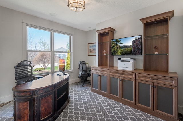 office space with baseboards