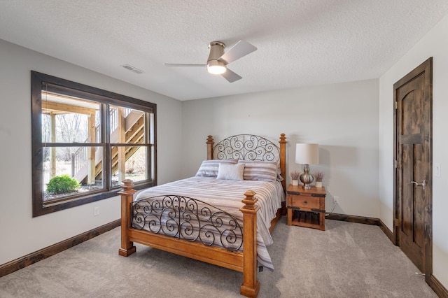 bedroom featuring carpet floors, baseboards, and visible vents