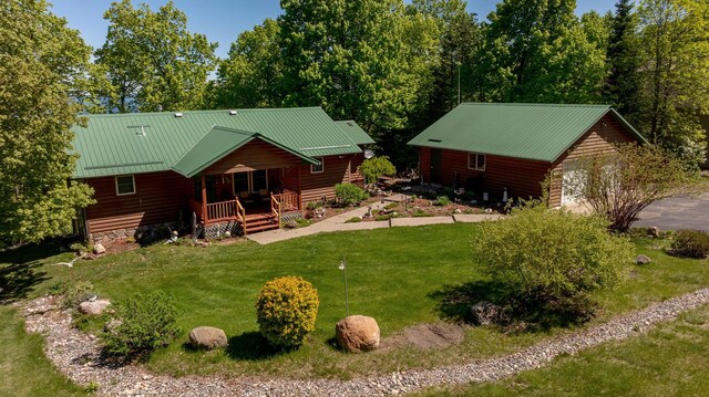 2064 View Dr NW, Walker, MN 56484 - rear view of house featuring a porch, a lawn, and metal roof
