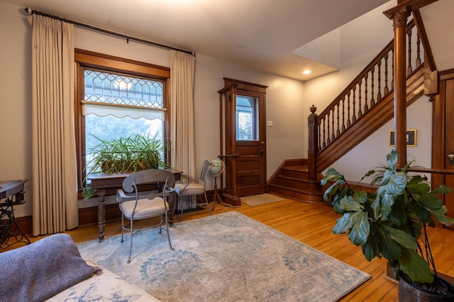 entryway featuring recessed lighting, baseboards, stairway, and hardwood / wood-style floors