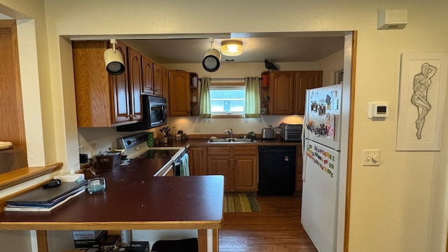 kitchen with open shelves, dark countertops, dark wood-type flooring, a sink, and black appliances