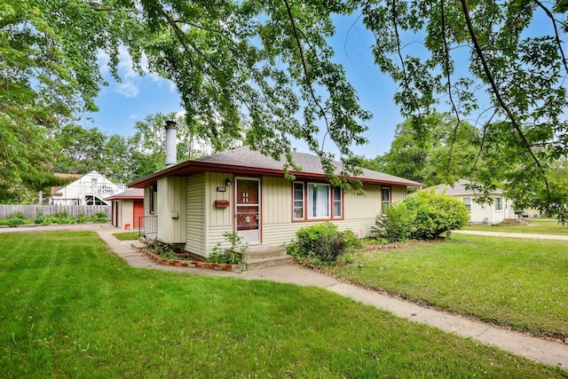 6001 Bryant Ave N, Brooklyn Center, MN 55430 - view of front facade featuring a chimney, a garage, and roof with shingles