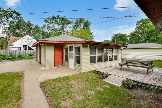 6001 Bryant Ave N, Brooklyn Center, MN 55430 - back of house with a deck and a garage