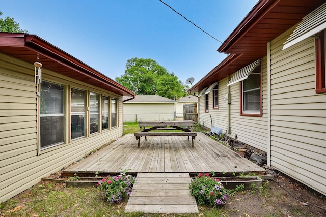 6001 Bryant Ave N, Brooklyn Center, MN 55430 - wooden deck featuring outdoor dining area