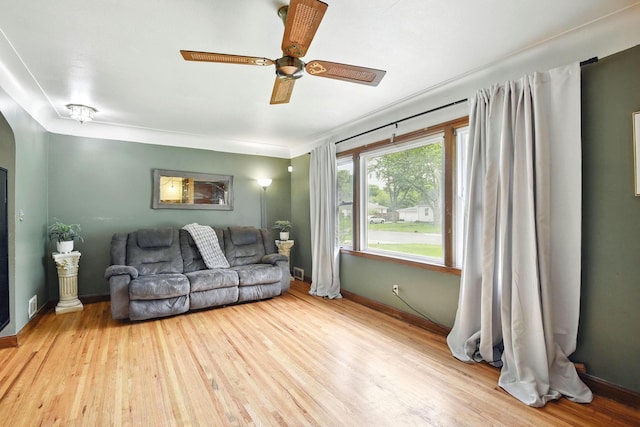 6001 Bryant Ave N, Brooklyn Center, MN 55430 - living area featuring wood finished floors, baseboards, and a ceiling fan