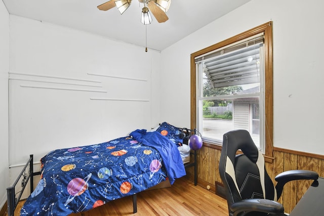 6001 Bryant Ave N, Brooklyn Center, MN 55430 - bedroom featuring wood finished floors and ceiling fan