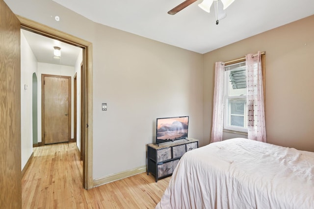 6001 Bryant Ave N, Brooklyn Center, MN 55430 - bedroom featuring light wood finished floors, baseboards, a ceiling fan, and attic access