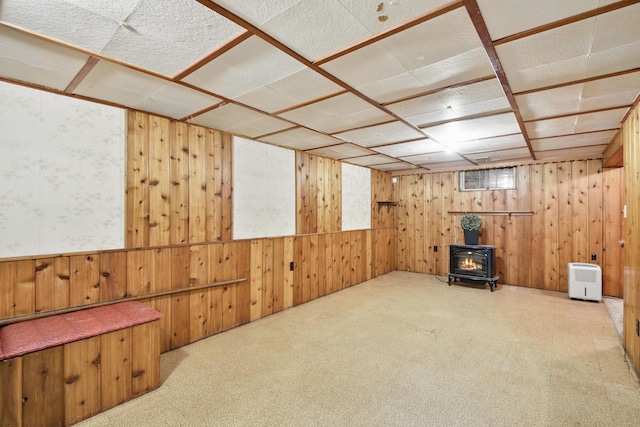 6001 Bryant Ave N, Brooklyn Center, MN 55430 - basement featuring a wood stove and wooden walls