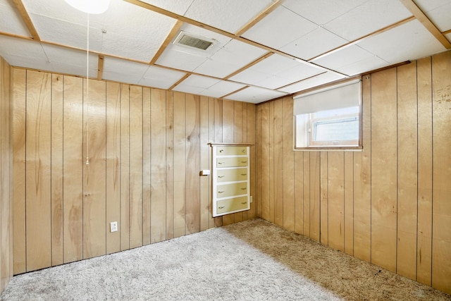 6001 Bryant Ave N, Brooklyn Center, MN 55430 - carpeted empty room featuring wood walls