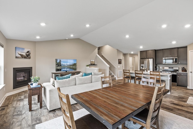 dining space with stairway, recessed lighting, light wood-type flooring, and visible vents
