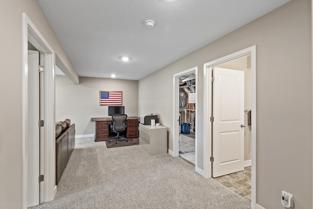 carpeted office space with baseboards and recessed lighting